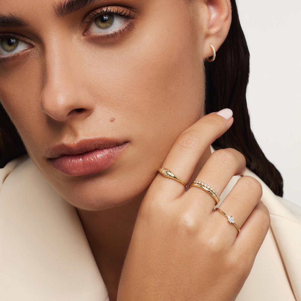 Golden ring in the shape of a diamond