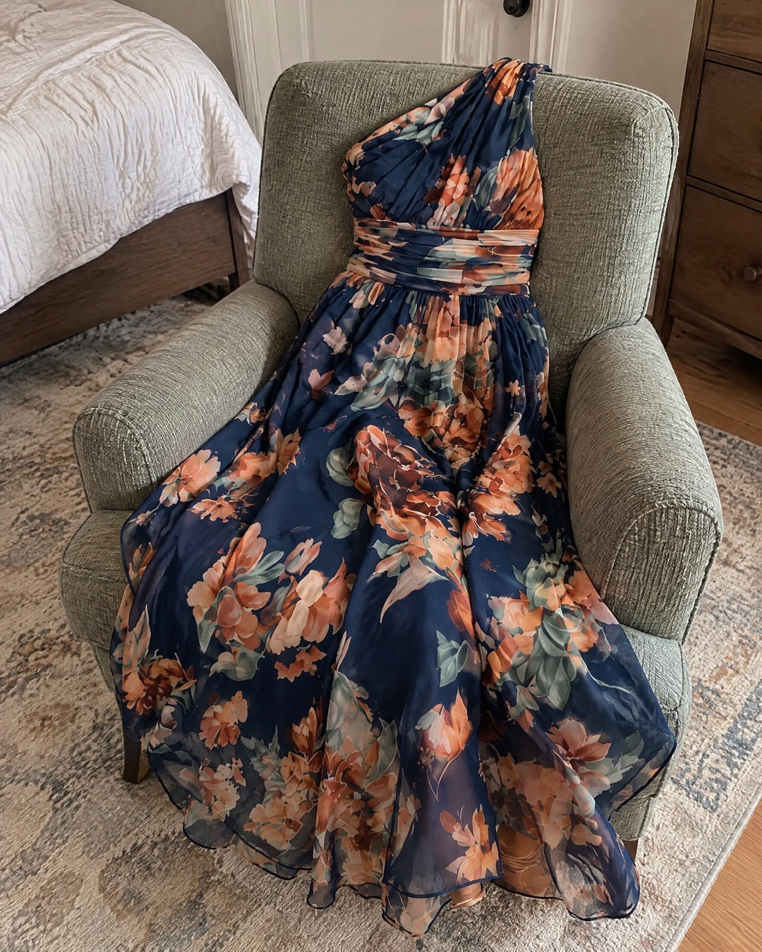 Celeste floral maxi dress draped naturally over an armchair