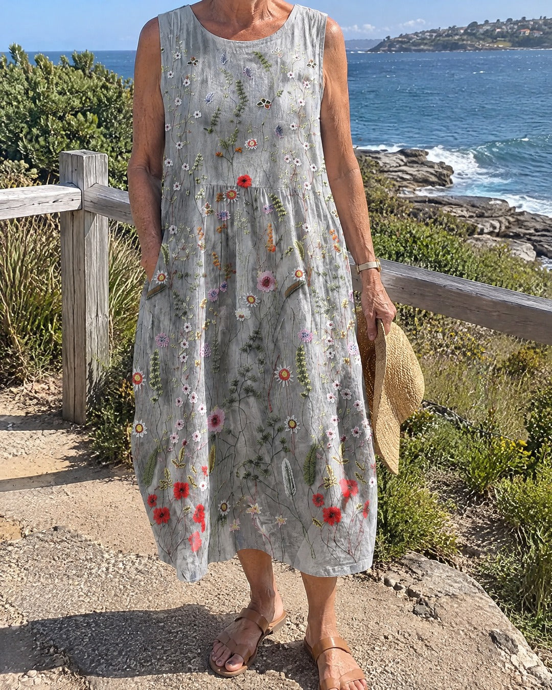 Agnes Wildflower grey midi dress worn by mature woman on coastal path