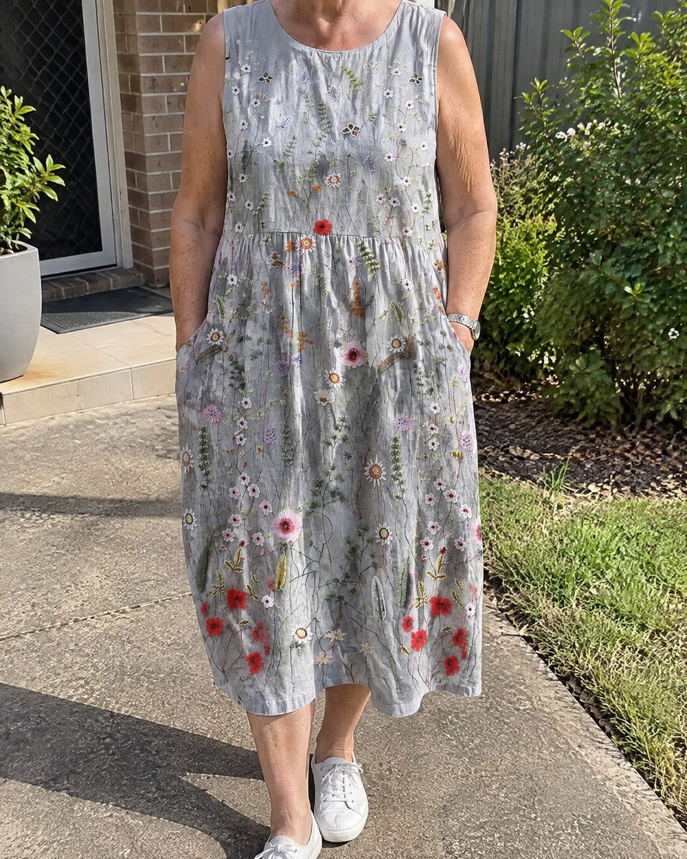 Agnes grey floral midi dress worn casually outdoors with sneakers and pockets