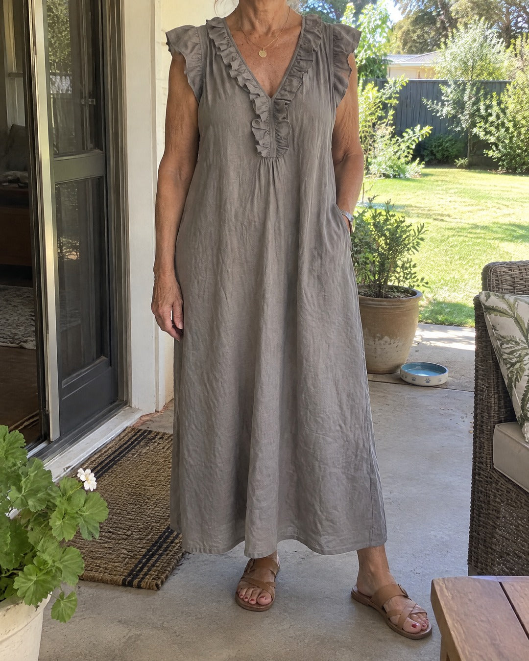 Josette relaxed ruffle dress worn on a home verandah