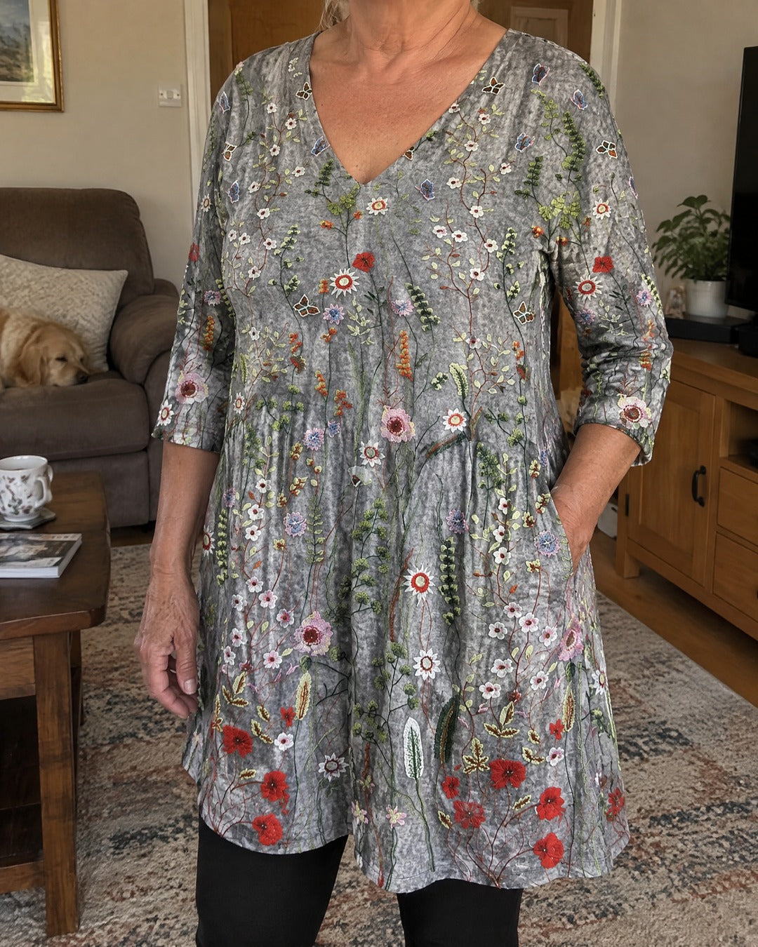 Lana longline V-neck floral blouse worn indoors showing front and side pocket