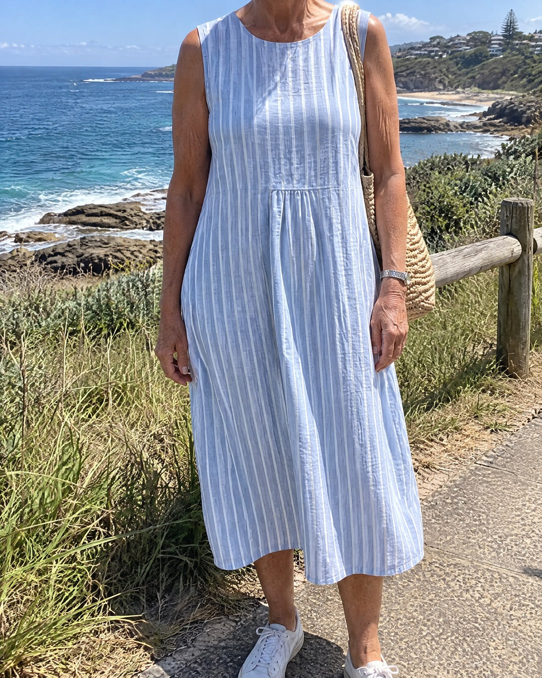 Dina blue striped midi dress worn for a coastal walk