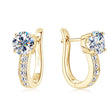 Golden huggie earrings with moissanite